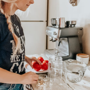 kiersten zile setting up supplies to ferment tomatoes